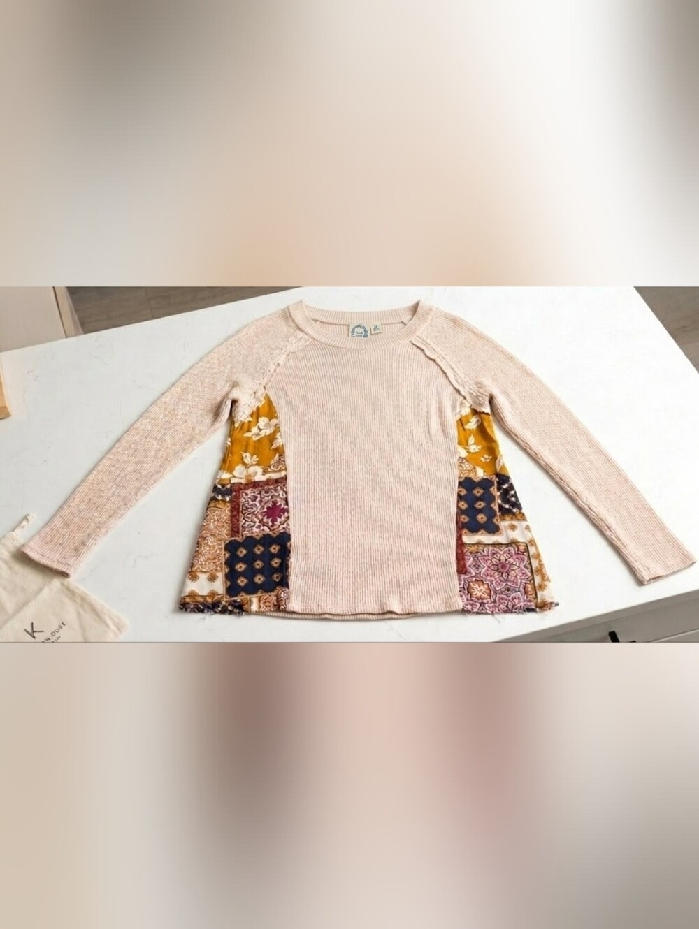 Blue Rain cream knit top with navy and mustard floral trim